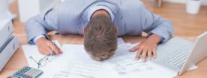 Image of contracting business owner stressed out.